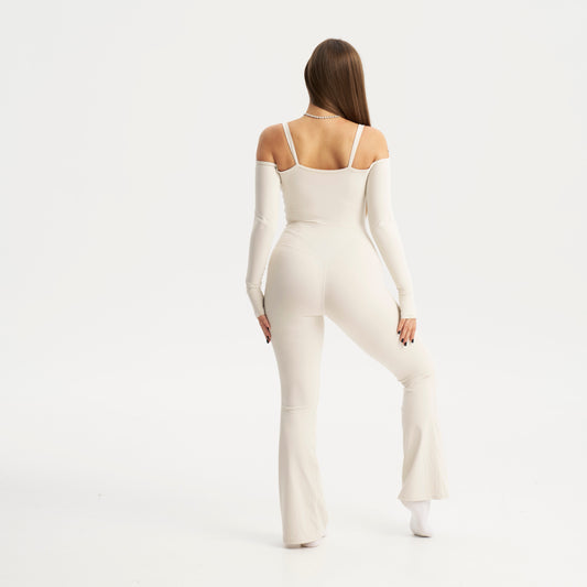 Woman wearing a white bodysuit on a white background