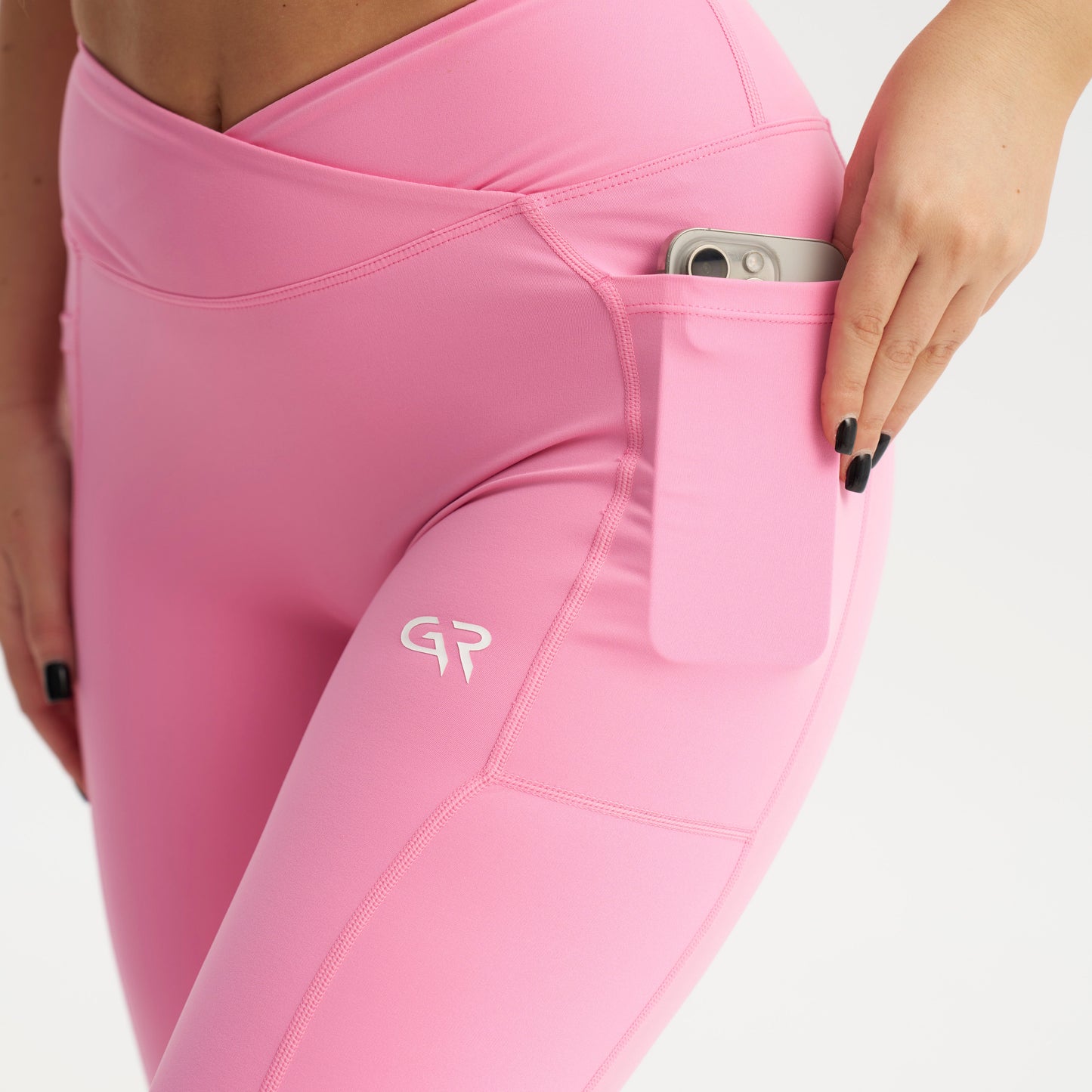 Pink leggings with a brand logo on a white background