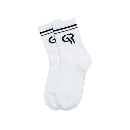White sock with black logo on a brown background